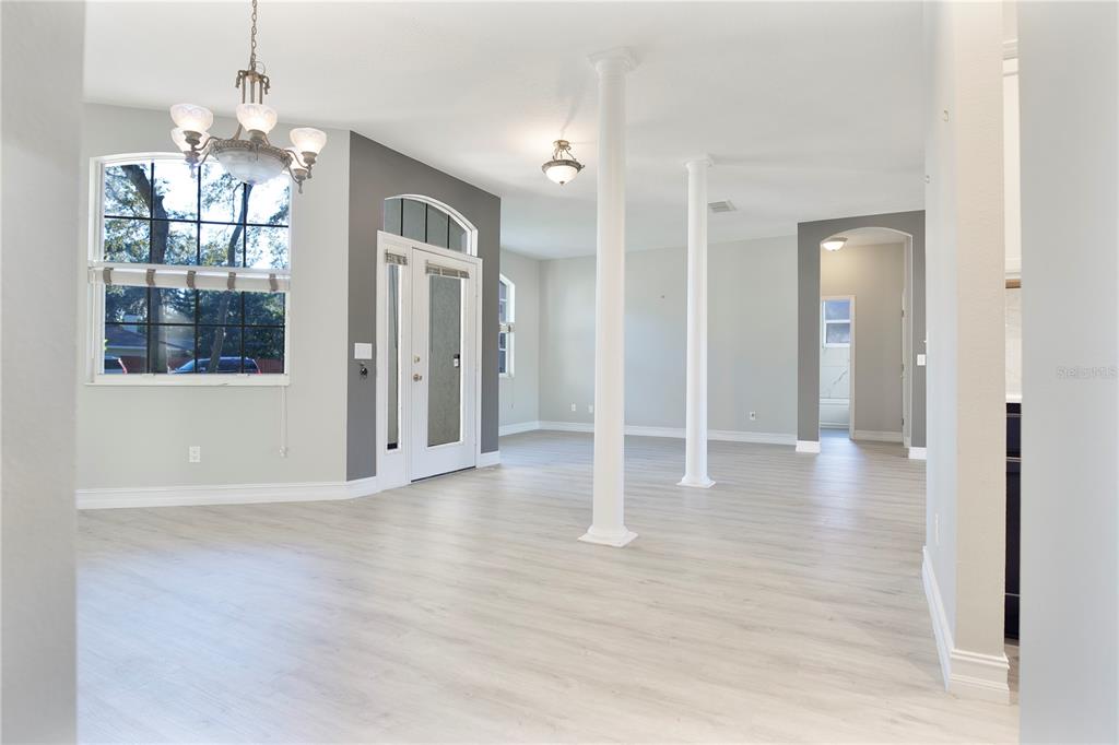 2560 Tall Maple Loop Ocoee, FL 34761 - Photo 23 of 32 a view of a room with wooden floor and windows