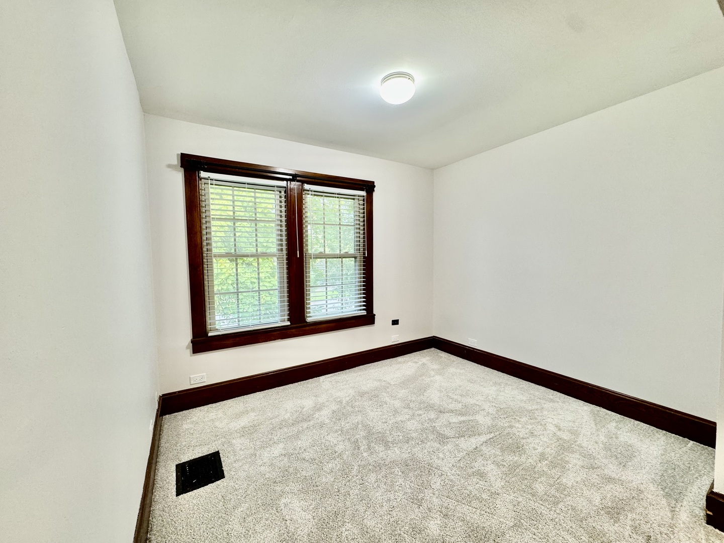 2506 Green Bay Road, Unit 2 Highland Park, IL 60035 - Photo 4 of 11 an empty room with a window