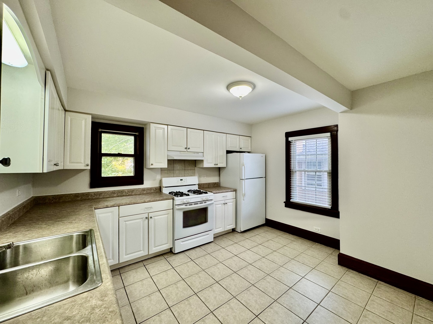2506 Green Bay Road, Unit 2 Highland Park, IL 60035 - Photo 5 of 11 a kitchen with a stove a sink and a microwave