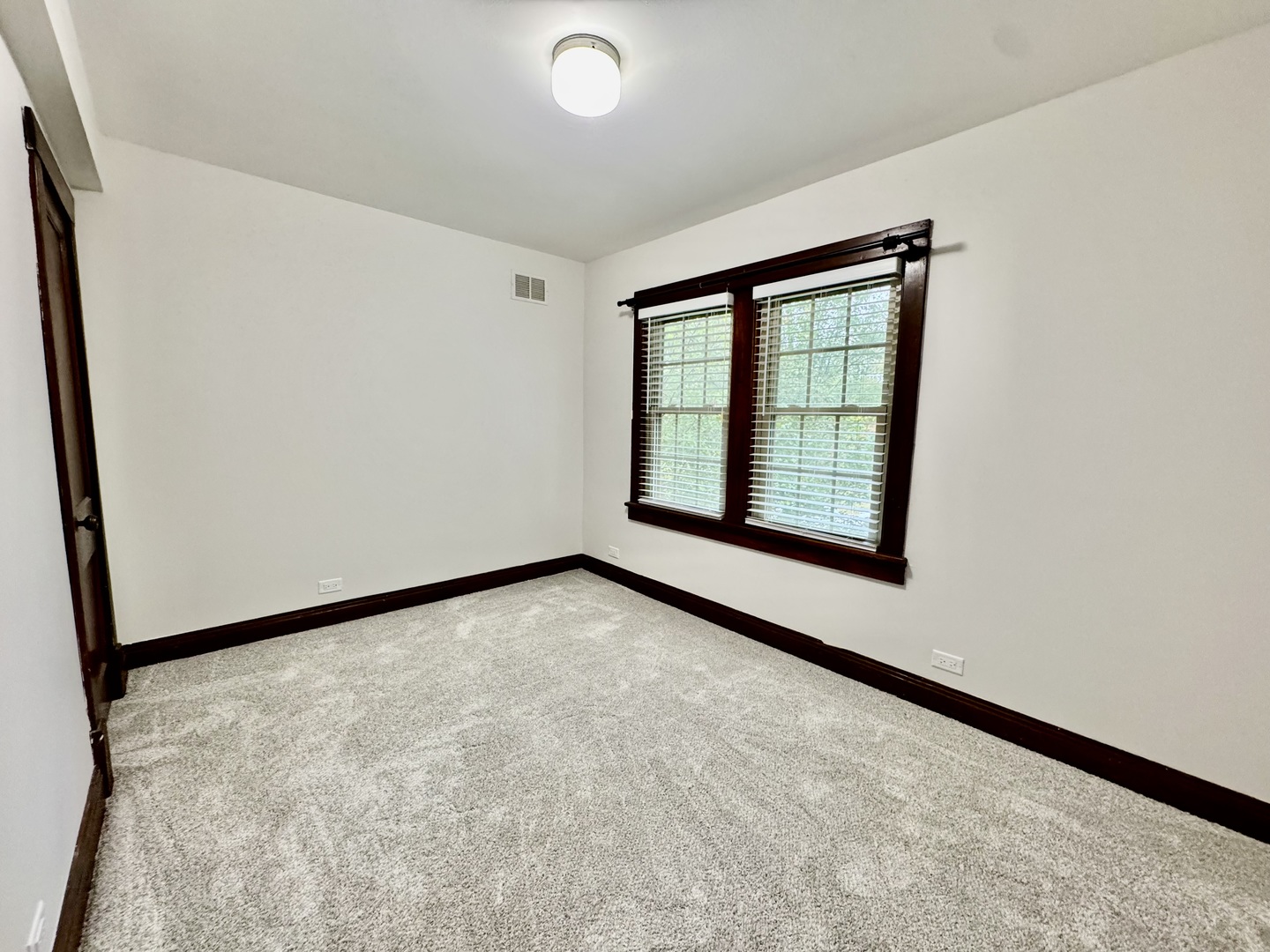 2506 Green Bay Road, Unit 2 Highland Park, IL 60035 - Photo 9 of 11 an empty room with windows