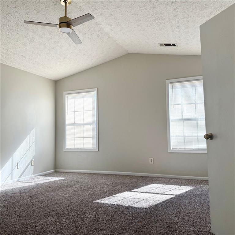 524 Julius Drive Stone Mountain, GA 30087 - Photo 13 of 17 an empty room with windows