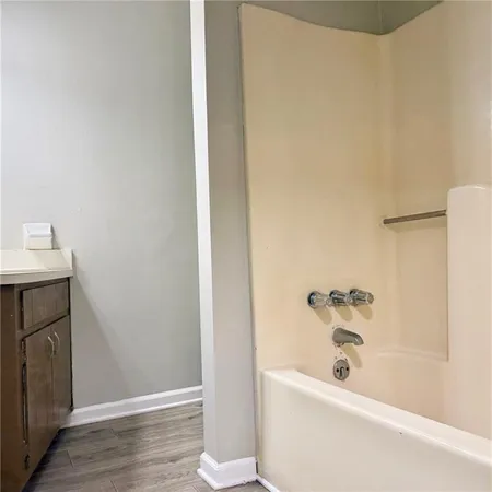 a bathroom with a bathtub and shower