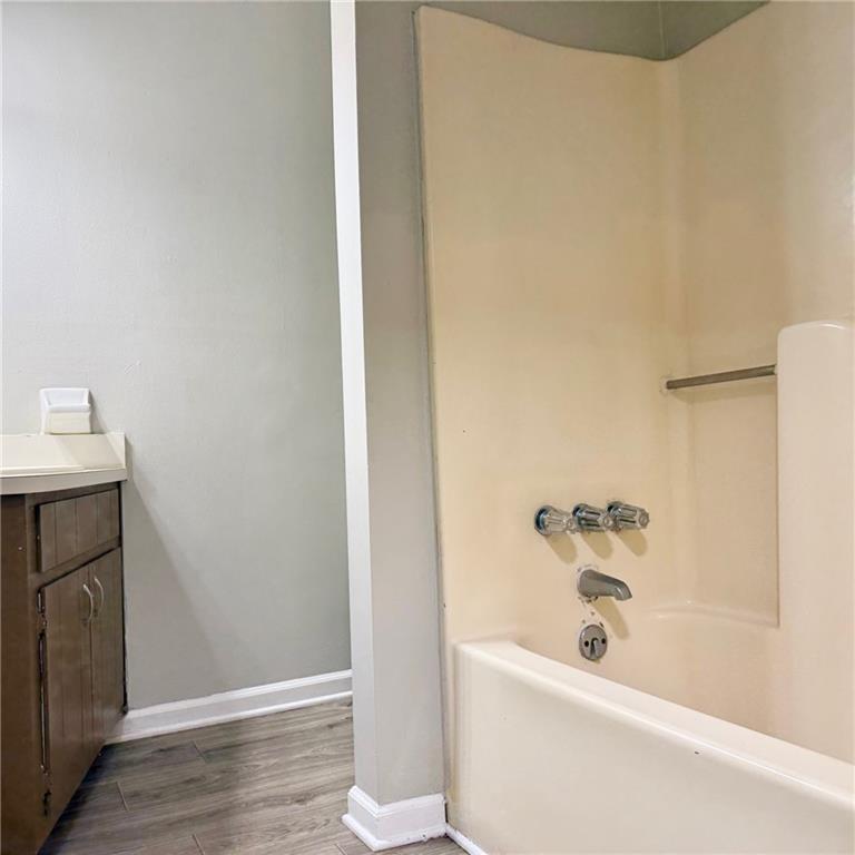 524 Julius Drive Stone Mountain, GA 30087 - Photo 9 of 17 a bathroom with a bathtub and shower