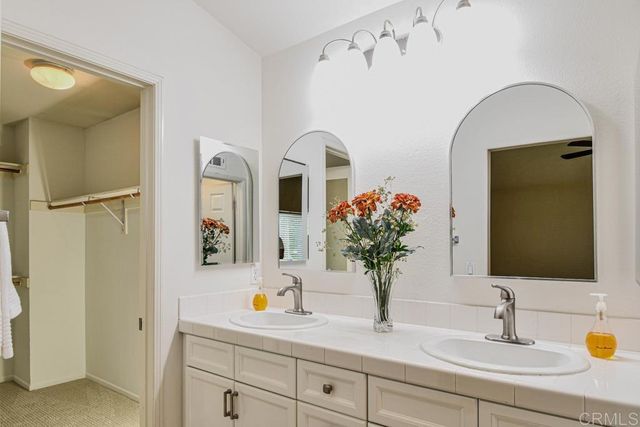 a bathroom with sink and mirror