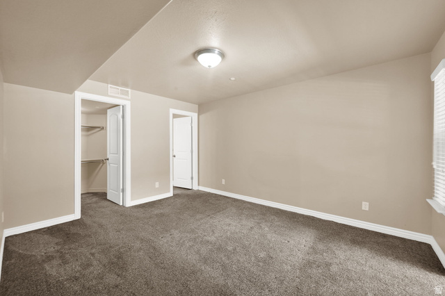 909 South Main Street, Unit G Layton, UT 84041 - Photo 14 of 25 Carpeted interior space featuring neutral wall tones and white baseboards