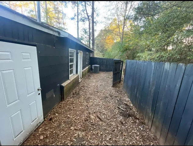 a view of a backyard of the house