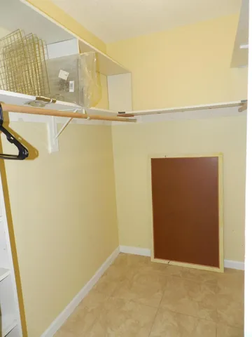 a view of walk in closet with window