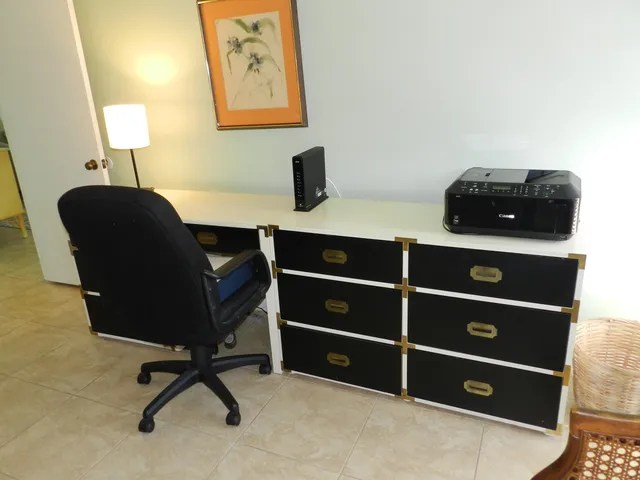 a view of a workspace with furniture