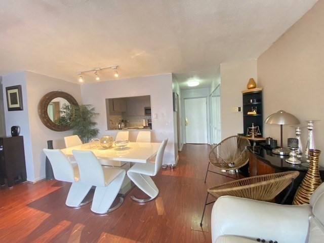 7 Weld Street, Unit 50 Framingham, MA 01702 - Photo 8 of 19 a view of a dining room with furniture and a chandelier