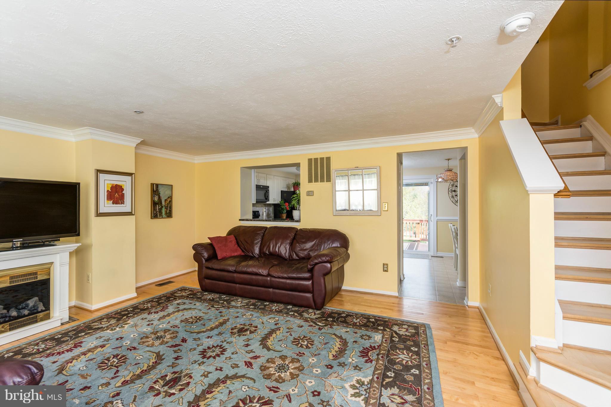 1234 Quaker Ridge Drive Arnold, MD 21012 - Photo 2 of 26 Spacious wood-floored living room provides