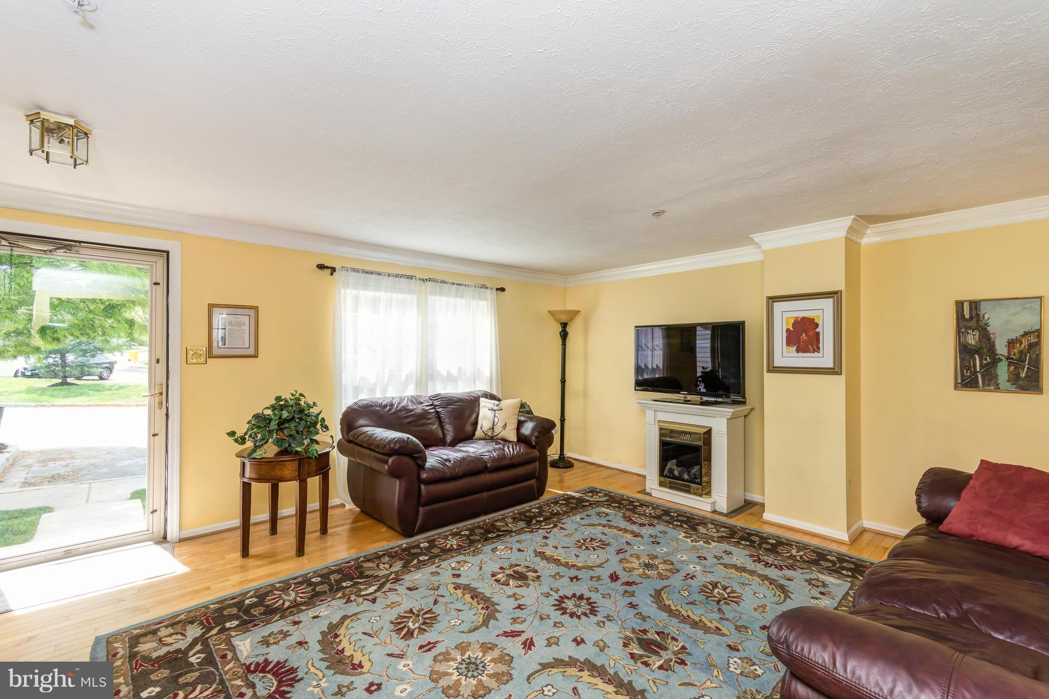 1234 Quaker Ridge Drive Arnold, MD 21012 - Photo 5 of 26 Crown moulding enhances the living room and