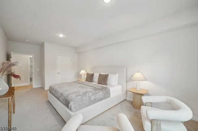 a bedroom with a bed and a couch