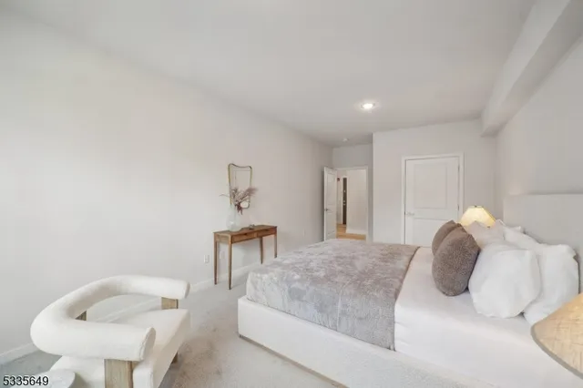 a bedroom with a bed and a chair