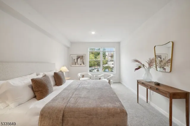 a bed room with a bed and a window