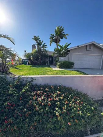 a swimming pool with outdoor seating and yard