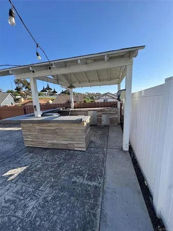 a kitchen with stainless steel appliances granite countertop a sink a stove and a microwave