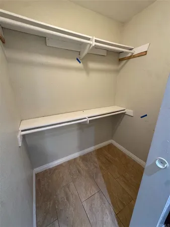 a view of room with wooden floor