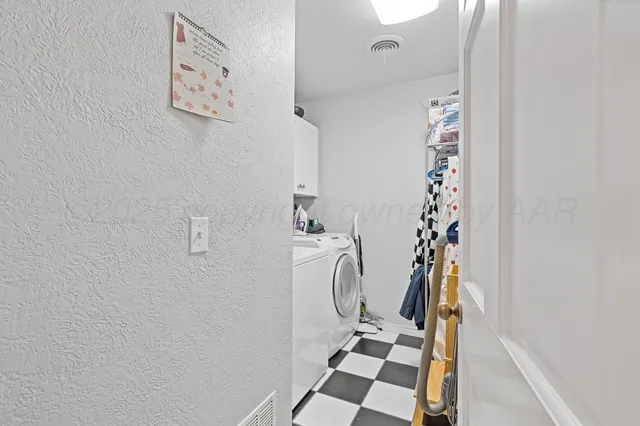 a bathroom with a shower curtain and a sink