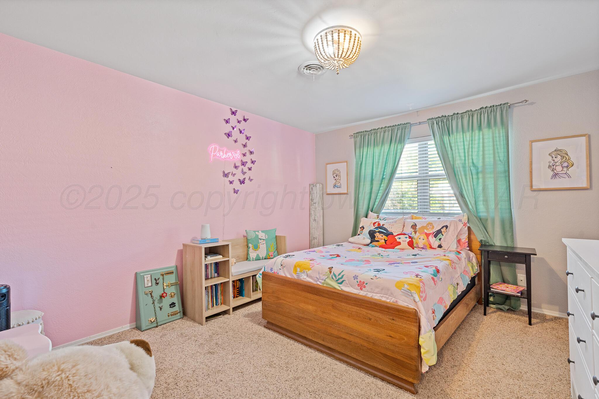 7602 Canode Drive Amarillo, TX 79121 - Photo 22 of 26 a bedroom with a bed and a window