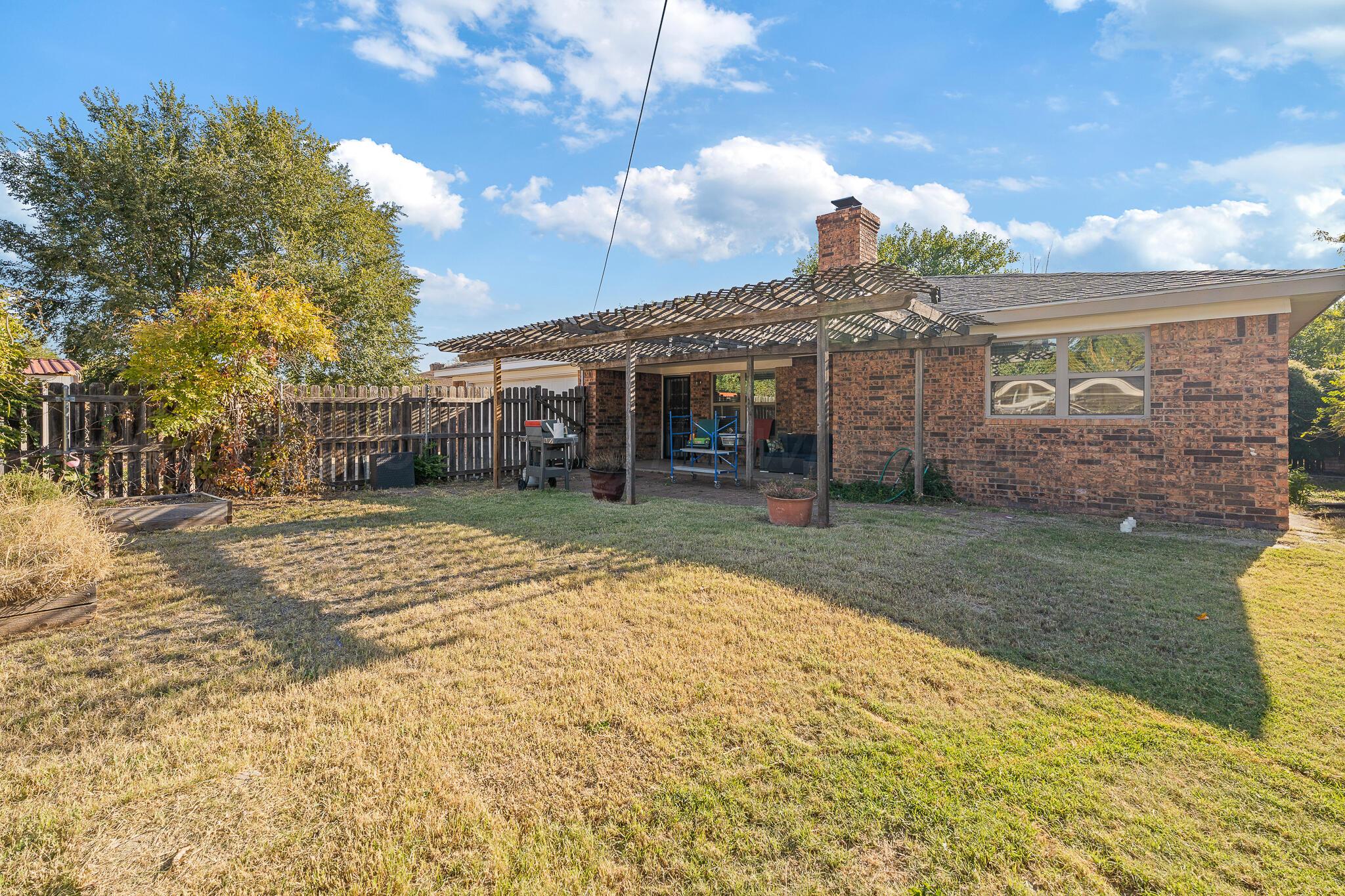7602 Canode Drive Amarillo, TX 79121 - Photo 24 of 26 a view of a house with a backyard