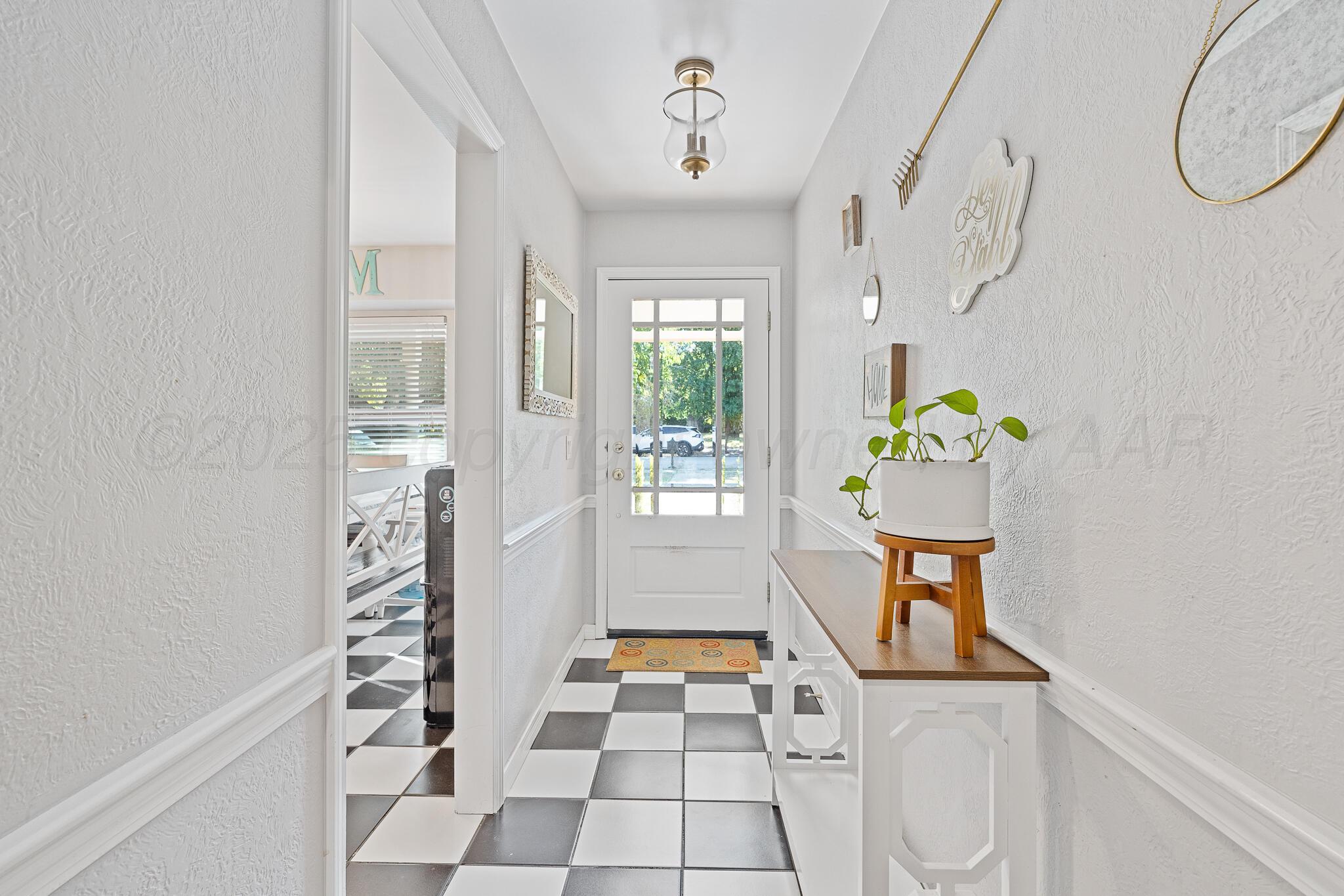 7602 Canode Drive Amarillo, TX 79121 - Photo 4 of 26 a room with window and glass door