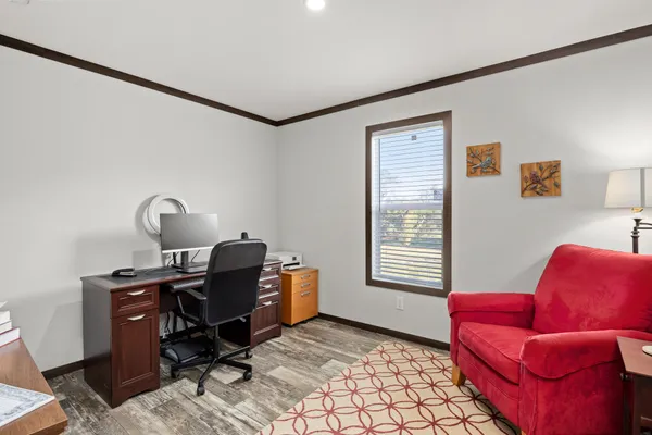 a workspace with furniture and window