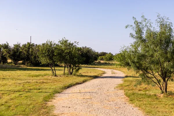 a view of a swimming pool with an outdoor space and seating area