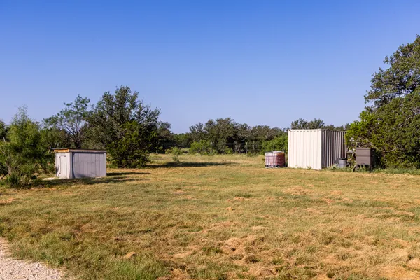 a view of two chairs in the balcony