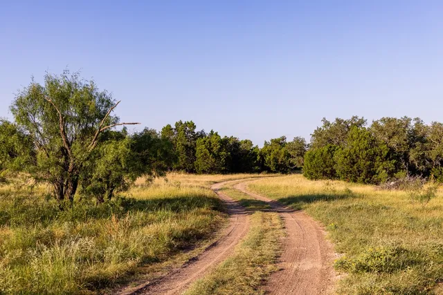 a large kitchen with granite countertop a large window and a sink
