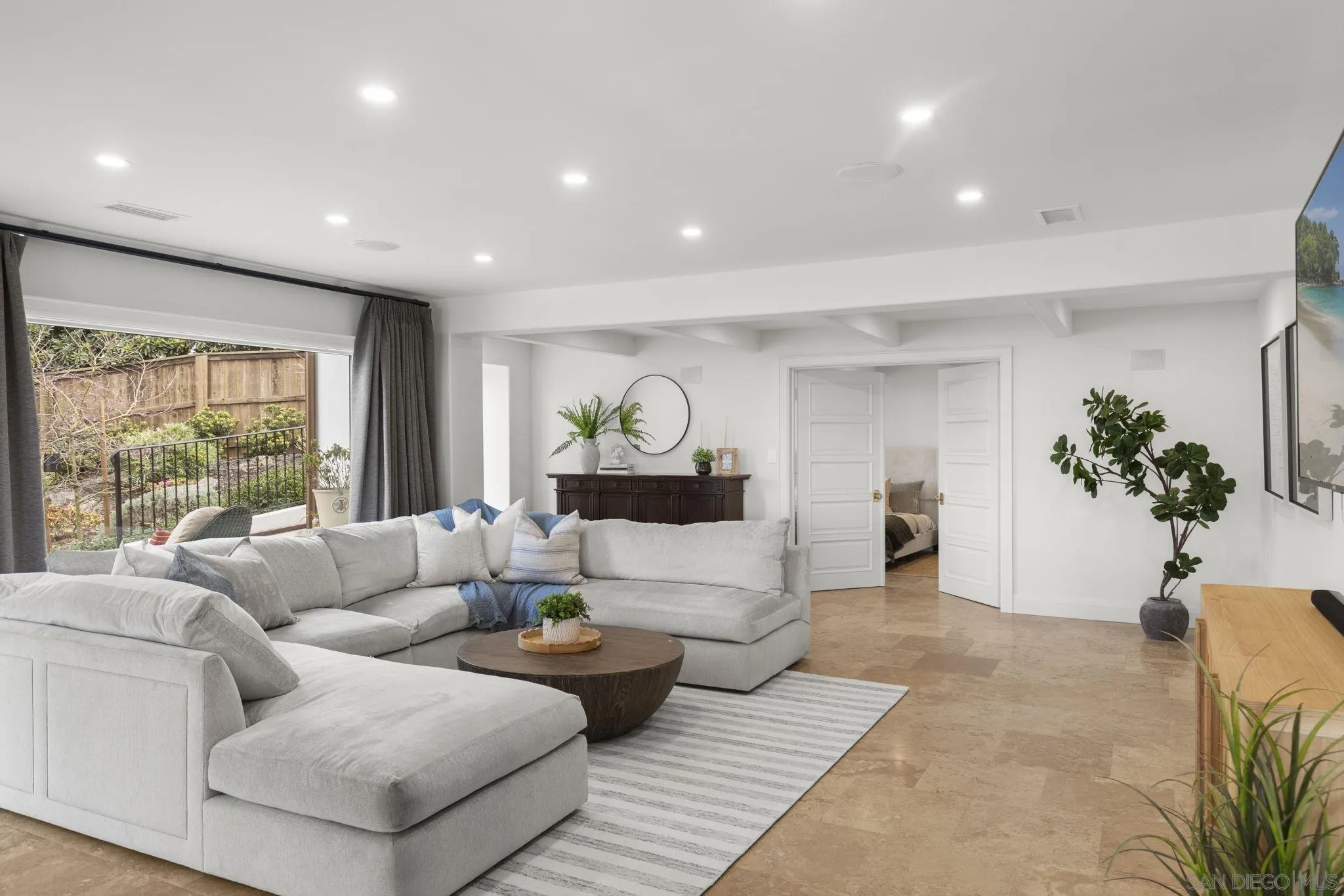 1542 El Paso Real La Jolla, CA 92037 - Photo 11 of 30 a living room with furniture and a large window