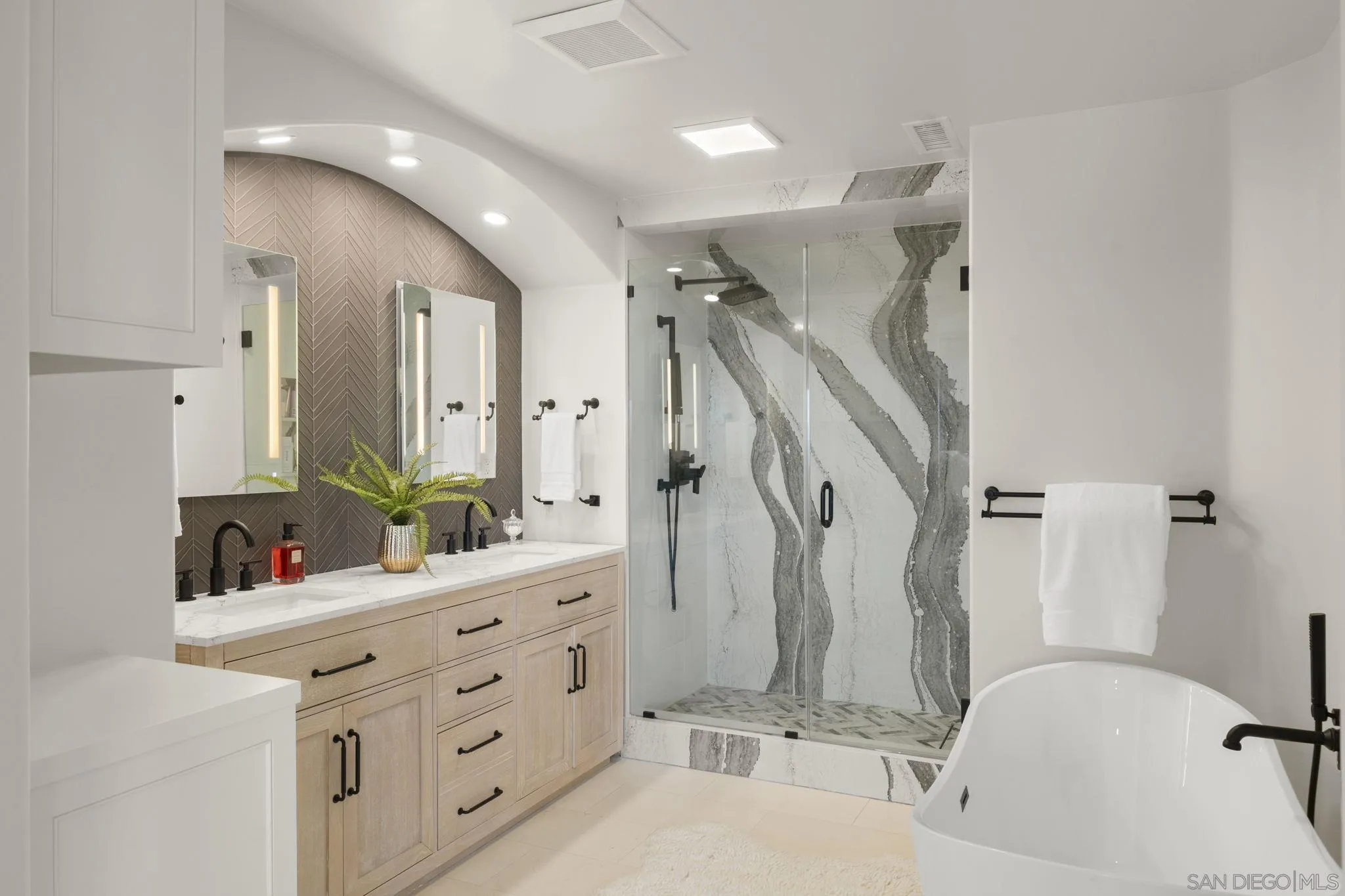 1542 El Paso Real La Jolla, CA 92037 - Photo 18 of 30 a bathroom with a double vanity sink mirror and bathtub