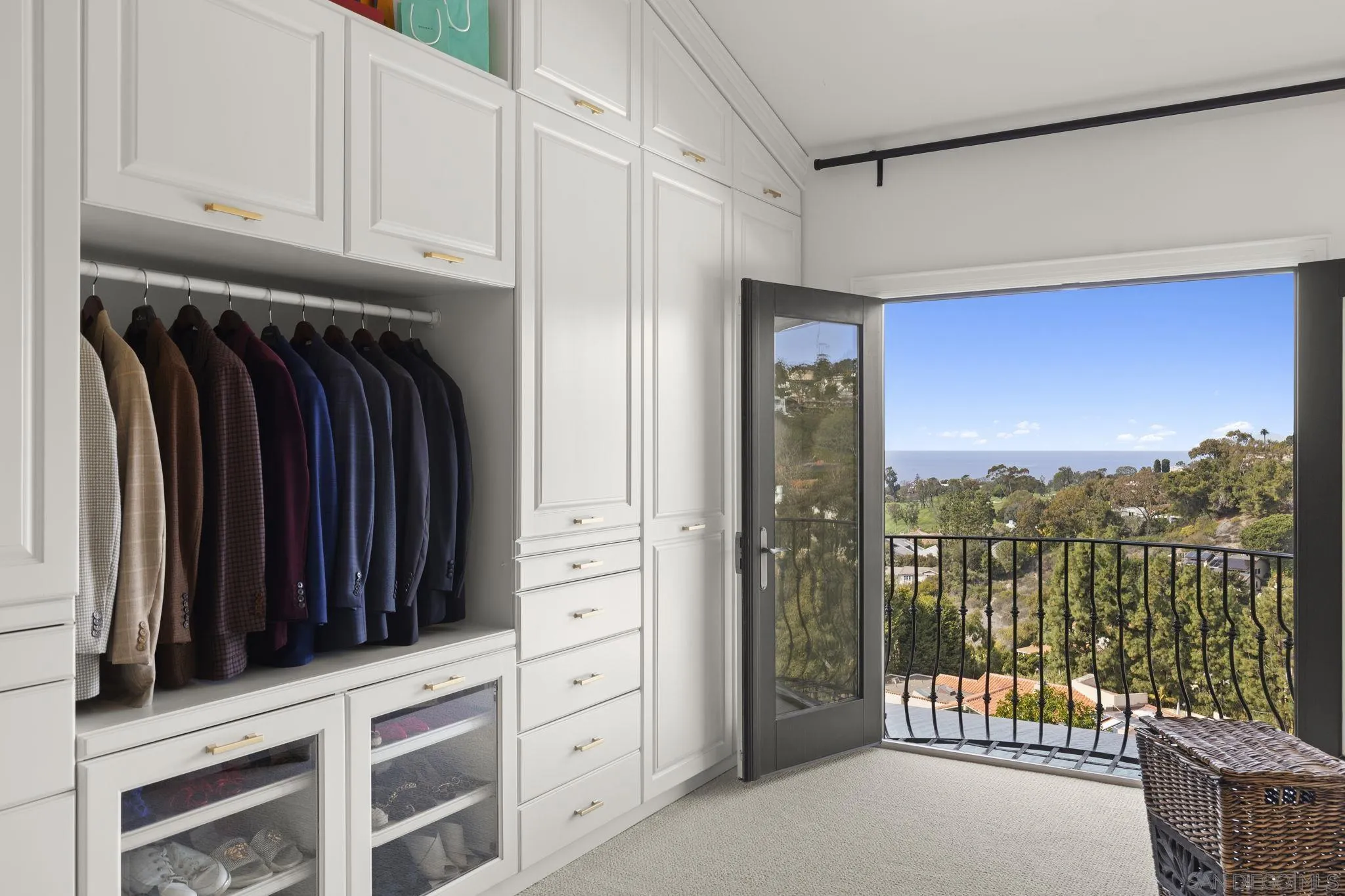1542 El Paso Real La Jolla, CA 92037 - Photo 19 of 30 a view of walk in closet with clothes and shoes