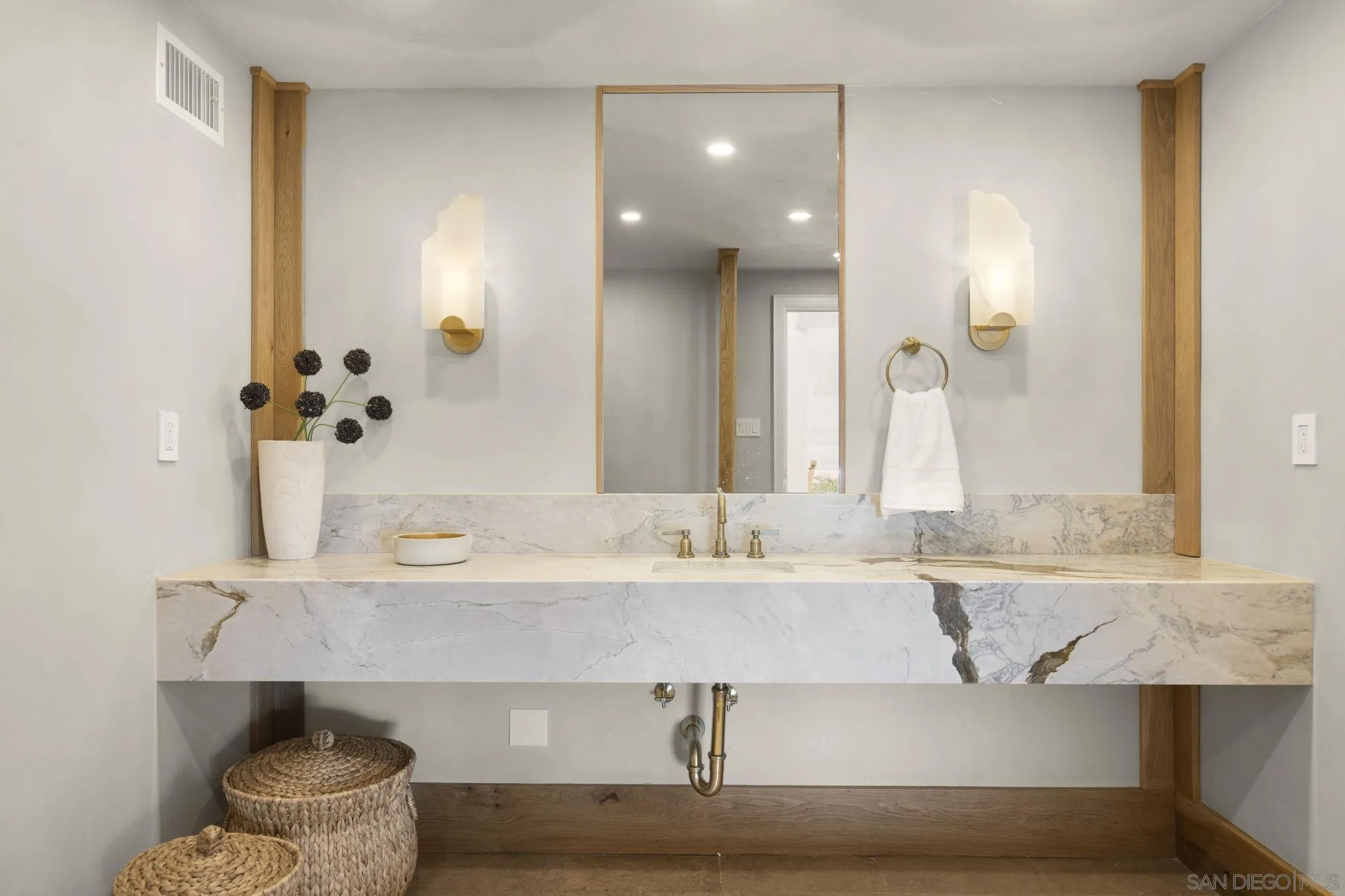 1542 El Paso Real La Jolla, CA 92037 - Photo 20 of 30 a bathroom with a sink and a mirror