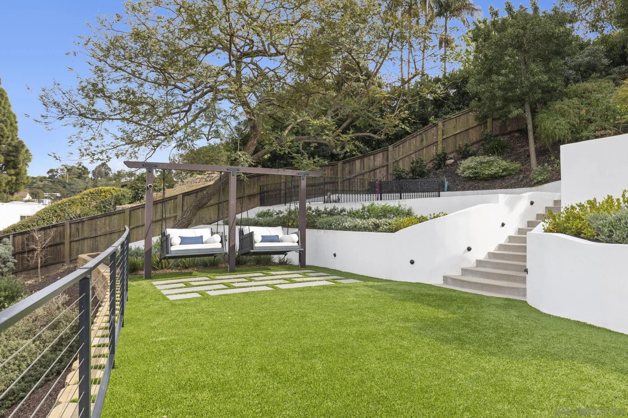 1542 El Paso Real La Jolla, CA 92037 - Photo 24 of 30 a view of a swimming pool with a patio and wooden fence