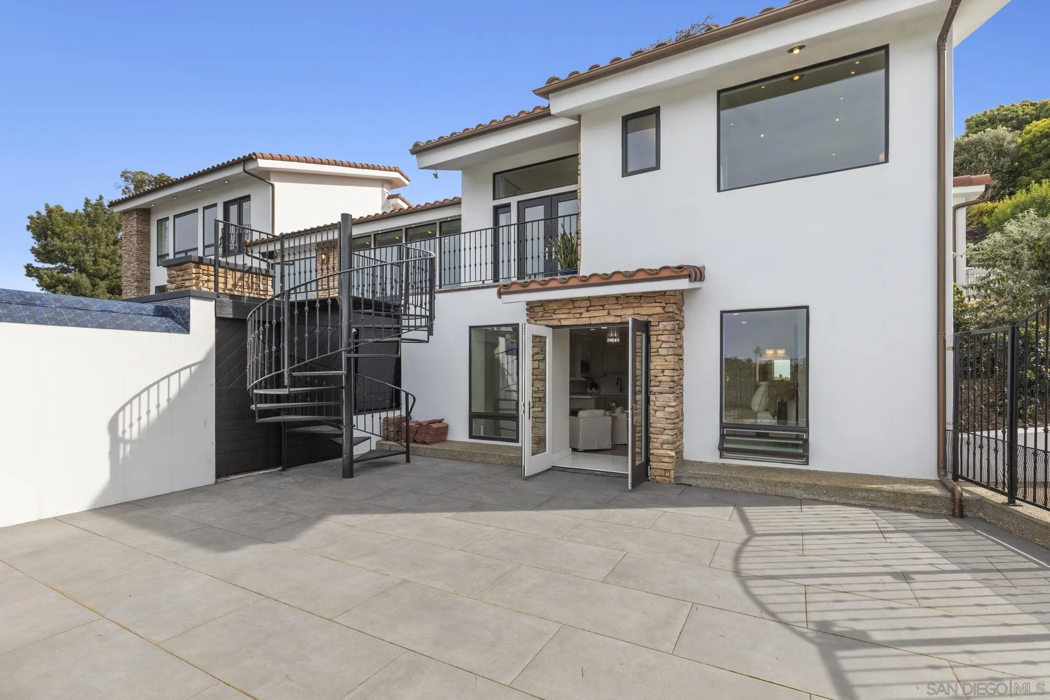 1542 El Paso Real La Jolla, CA 92037 - Photo 27 of 30 a view of a house with a barbeque and wooden stairs