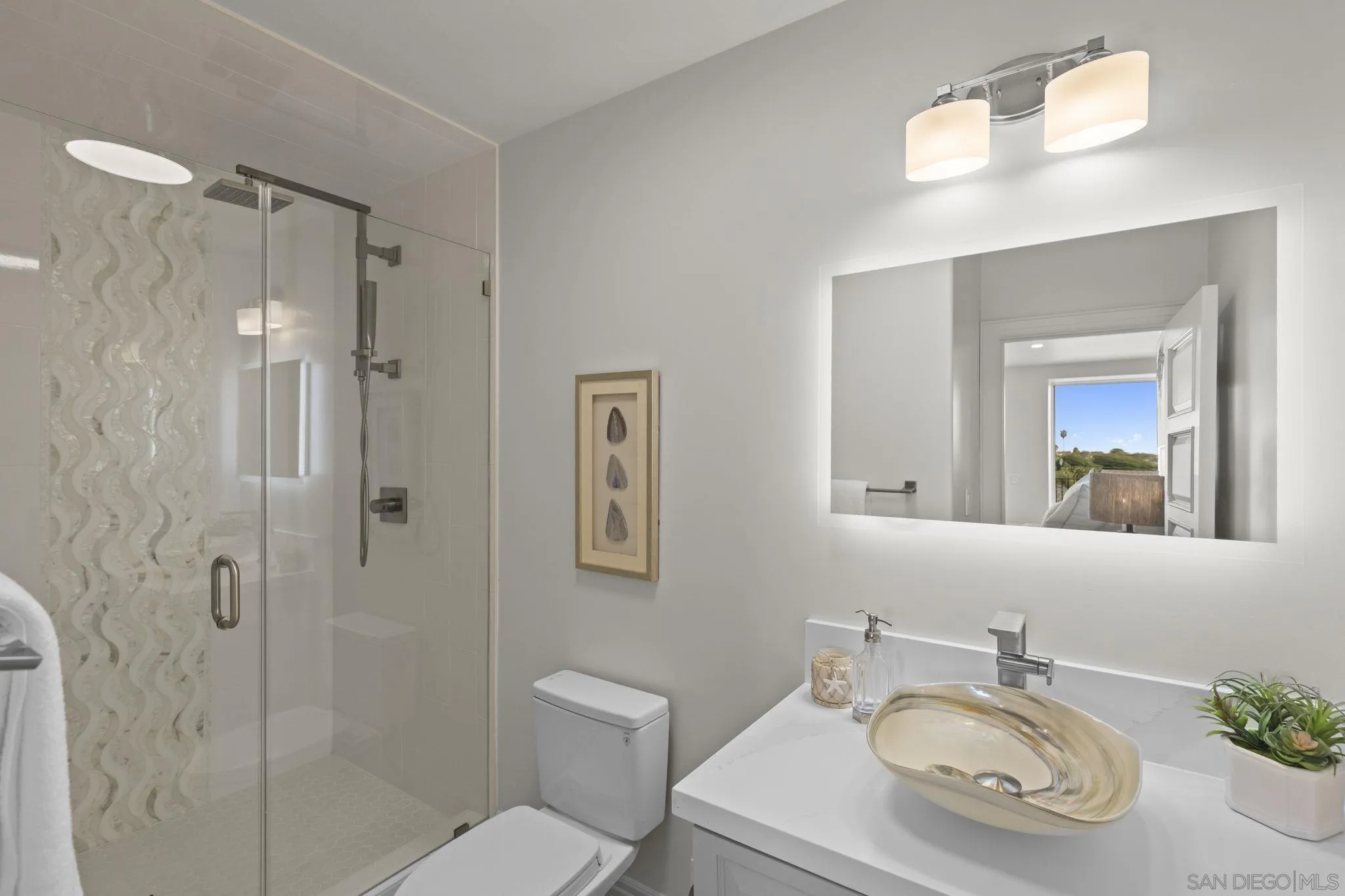 1542 El Paso Real La Jolla, CA 92037 - Photo 29 of 30 a bathroom with a sink a toilet and shower