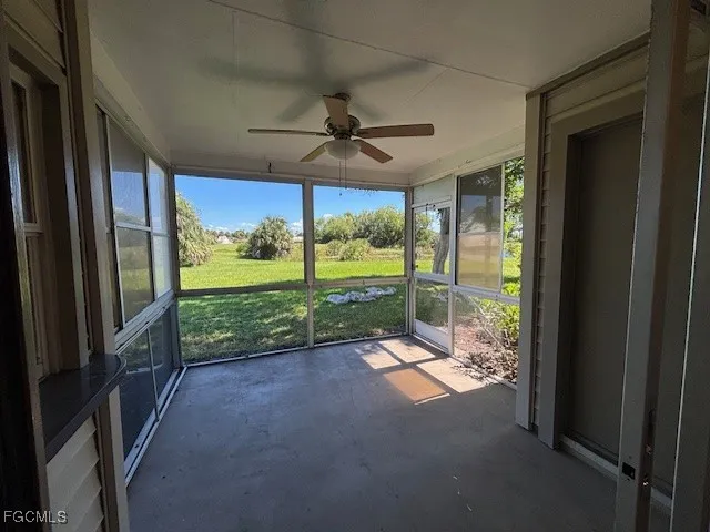 a view of a room with porch and wooden floor