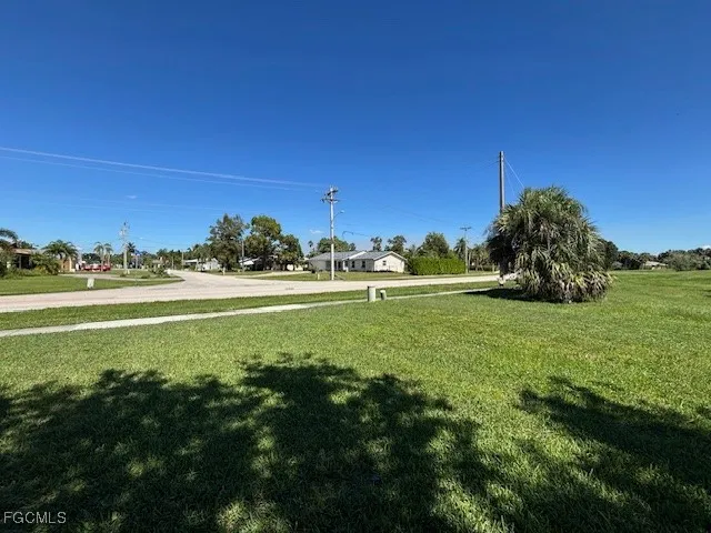 a view of a field with an ocean view