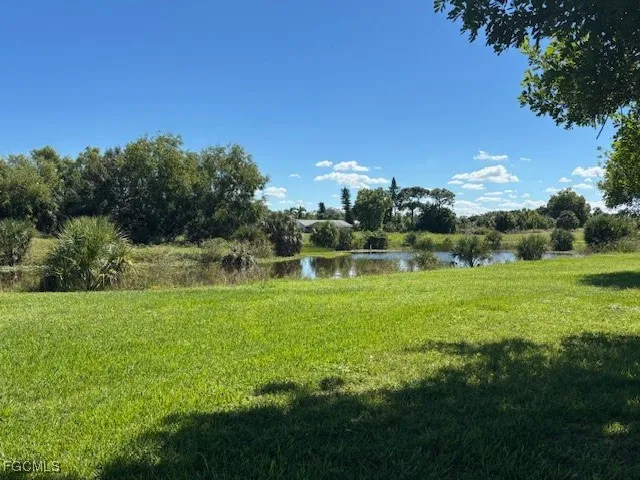 a view of a golf course with green space