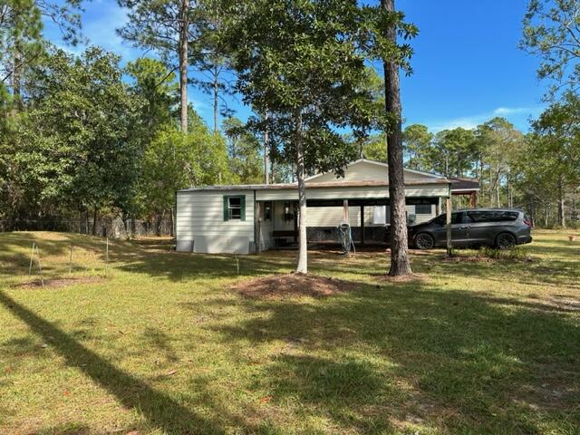 60 Magnolia Court Freeport, FL 32439 - Photo 14 of 29 a view of a house with a yard patio and swimming pool
