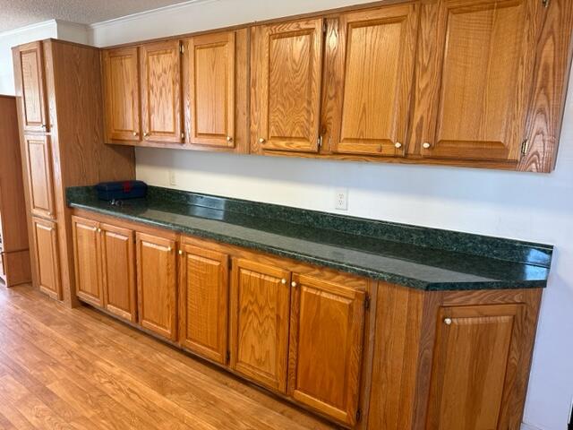 60 Magnolia Court Freeport, FL 32439 - Photo 4 of 29 a kitchen with granite countertop wooden cabinets