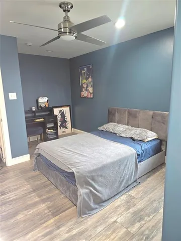 a bedroom with a bed and a table