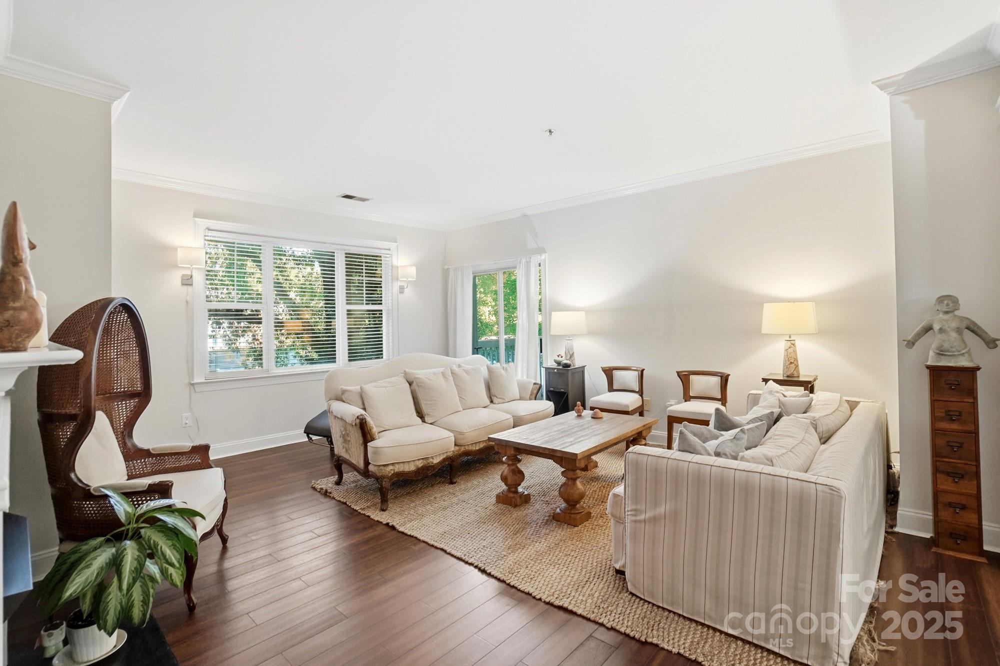 5617 Fairview Road, Unit 5 Charlotte, NC 28209 - Photo 1 of 26 a living room with furniture a window and wooden floor