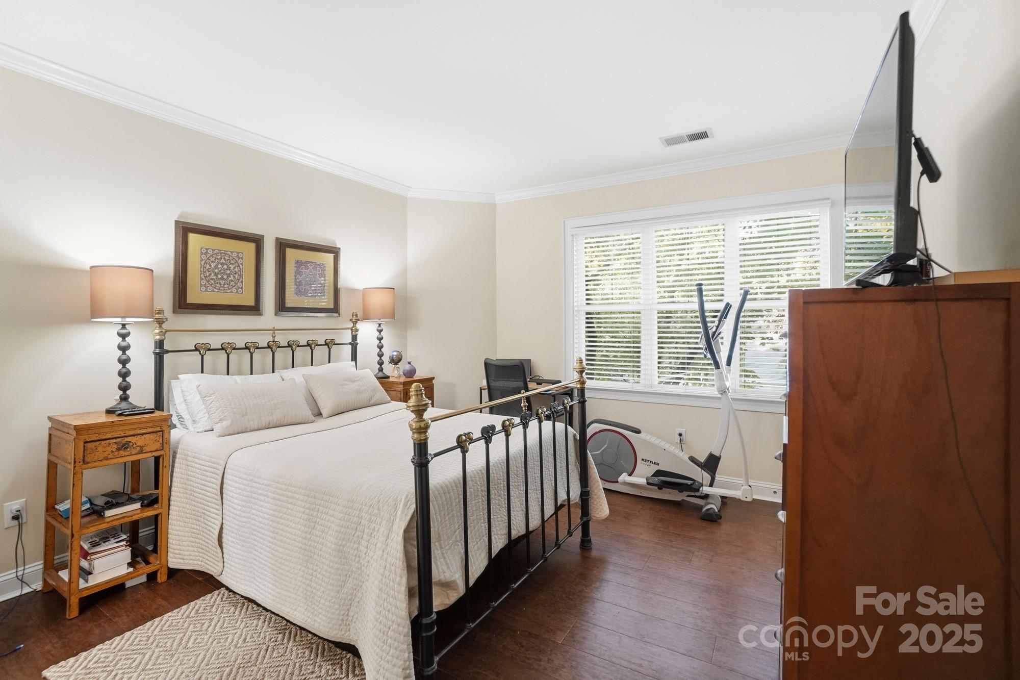 5617 Fairview Road, Unit 5 Charlotte, NC 28209 - Photo 14 of 26 a bedroom with a bed and a couch