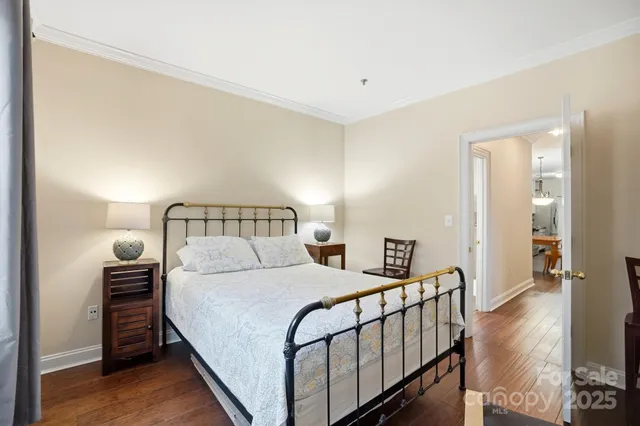 a bedroom with a bed and a night stand