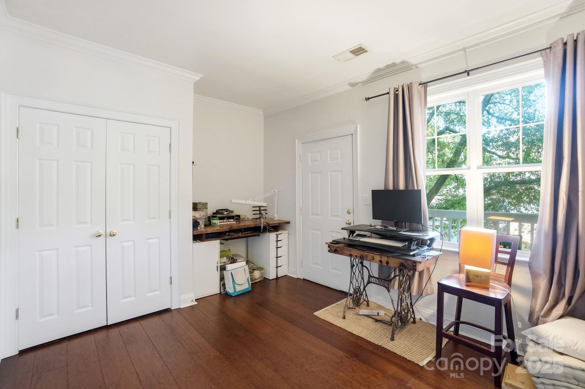 5617 Fairview Road, Unit 5 Charlotte, NC 28209 - Photo 22 of 26 a view of a workspace with furniture and a window