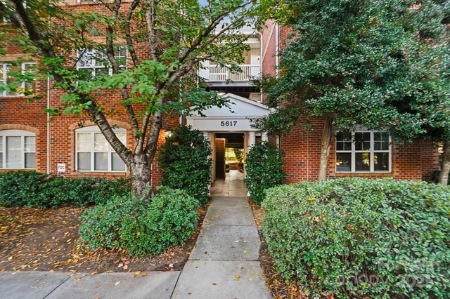 front view of a house with a garden