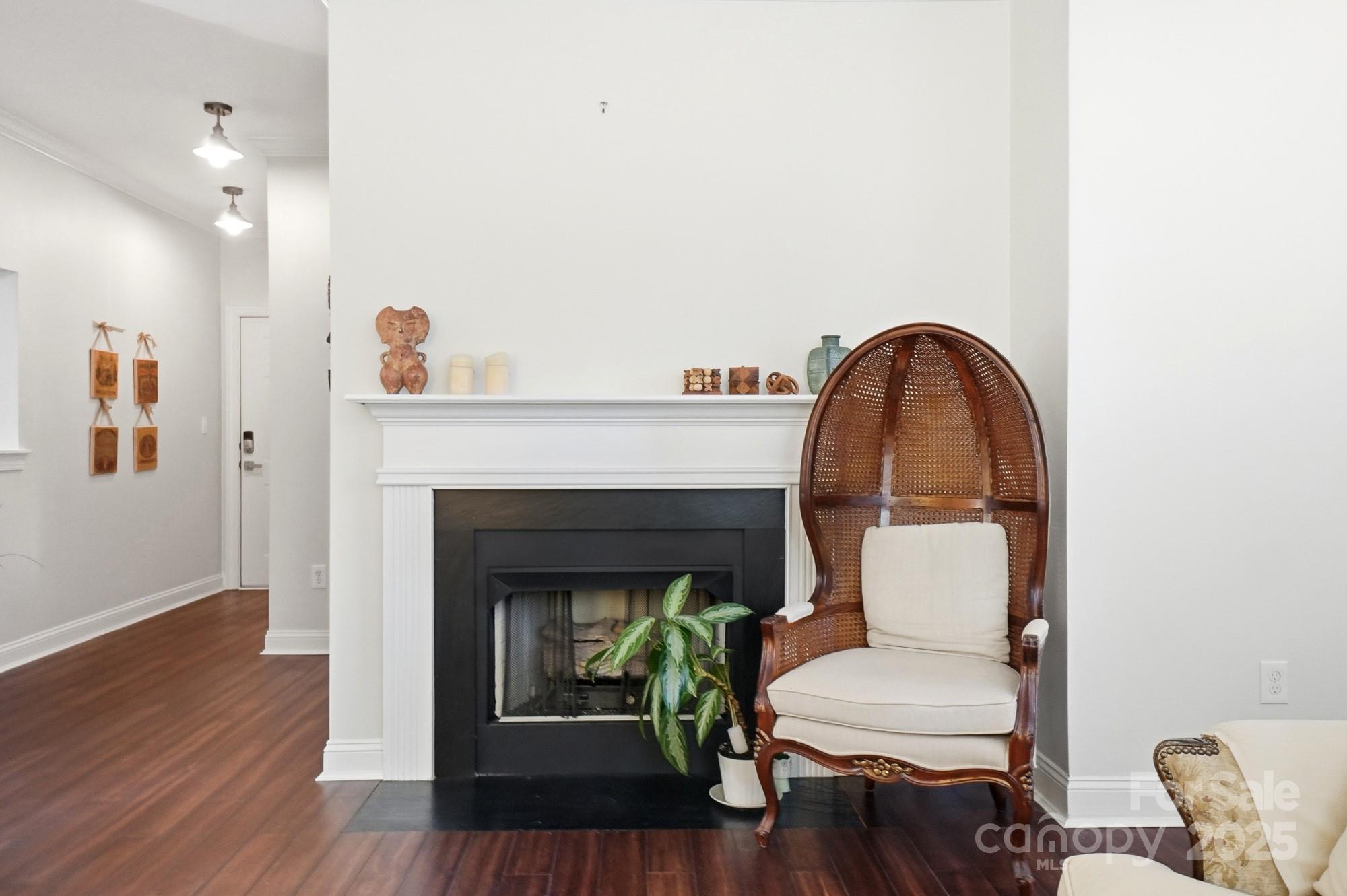 5617 Fairview Road, Unit 5 Charlotte, NC 28209 - Photo 7 of 26 a view of a livingroom with furniture and a fireplace