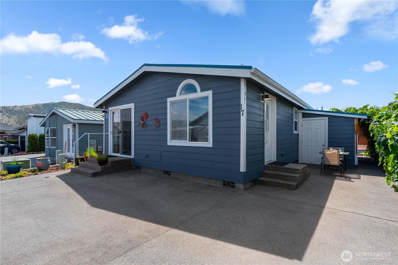 1000 Highway 150, Unit 17 Manson, WA 98831 - Photo 2 of 15 a backyard of a house with outdoor seating