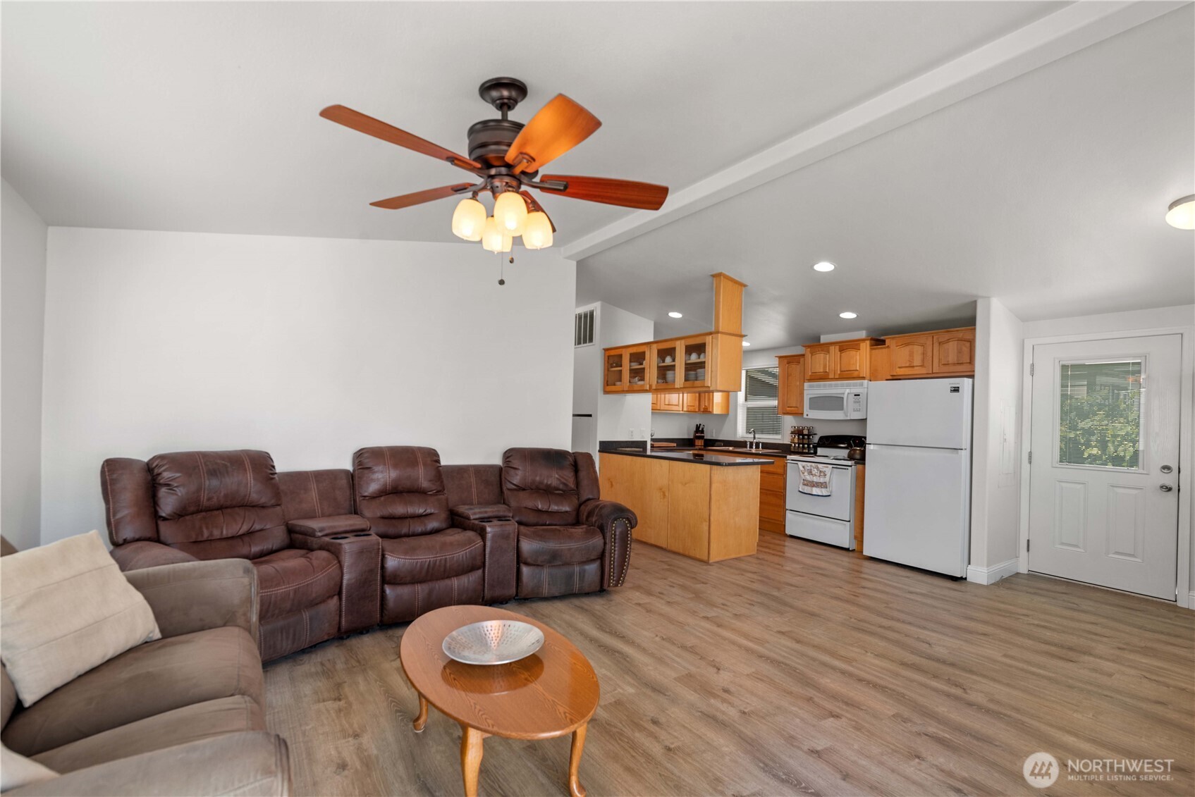 1000 Highway 150, Unit 17 Manson, WA 98831 - Photo 6 of 15 a living room with furniture kitchen view and a chandelier